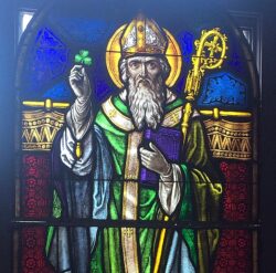 606px Jubilee Museum and Catholic Cultural Center Columbus Ohio stained glass Saint Patrick and a leprechaun e1615920289592