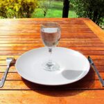 1238px Fasting 4 Fasting a glass of water on an empty plate
